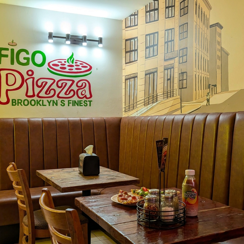 Figo Pizza dining area with brown leather booths, wooden tables, pizza, condiments, and colorful Brooklyn-themed wall murals.